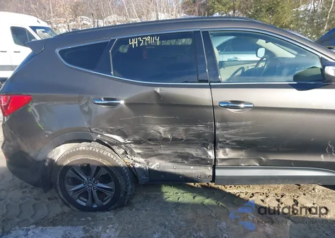 2014 Hyundai Santa Fe Sport 2.4L z USA, uszkodzony, nr VIN 5XYZUDLB2EG215798